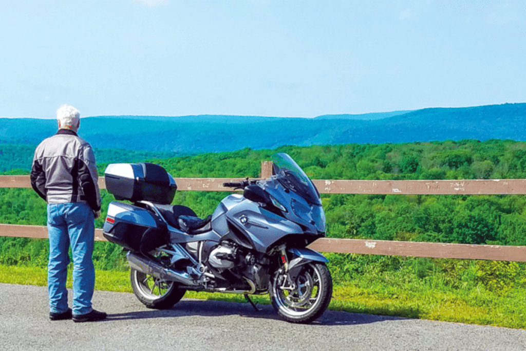 Motorcycle rider overlooking mountains in PA