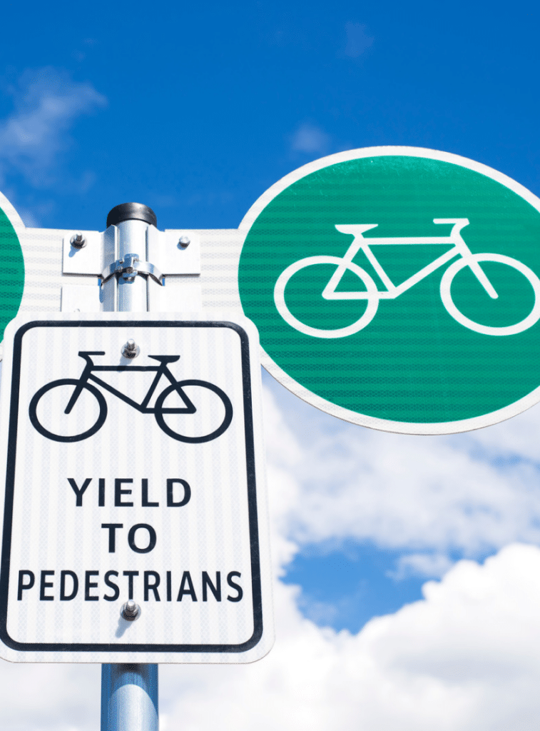 yield to pedestrians road sign
