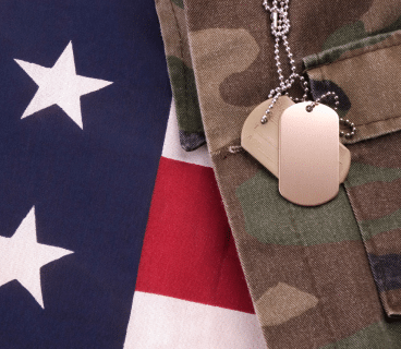 U.S. army uniform, dog tag, and U.S. flag