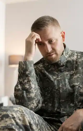 An army member looking distressed