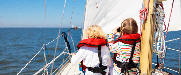 Two children sitting on a boat